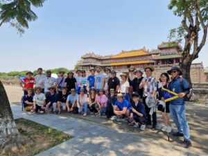Torus Team pose together for team picture at the Imperial City of Huế